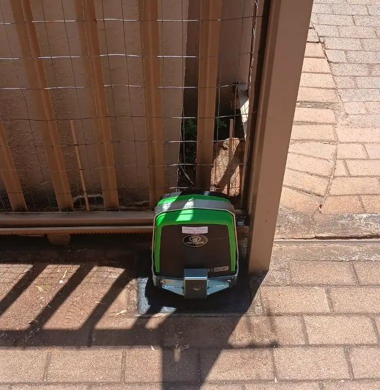 Gate motor at a paved driveway